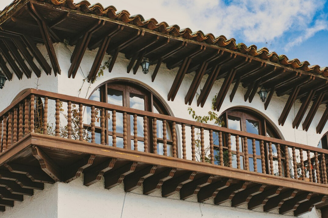 Historic colonial-style building facade with balconies
